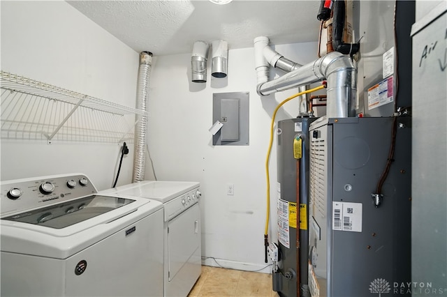 9670 Centerville Creek Ln, Washington Twp, OH 45458 - laundry area with washer and dryer, electric panel, water heater, light tile patterned floors, and heating unit