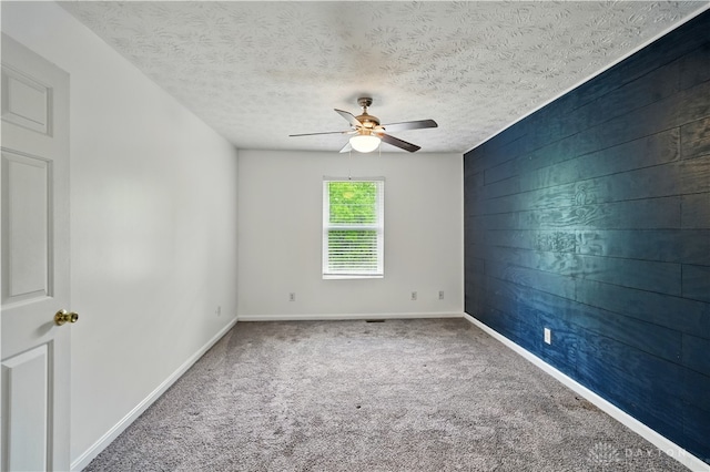 9670 Centerville Creek Ln, Washington Twp, OH 45458 - empty room with ceiling fan, carpet, baseboards, an accent wall, and a textured ceiling