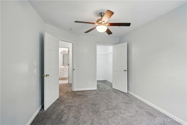 9670 Centerville Creek Ln, Washington Twp, OH 45458 - unfurnished bedroom with carpet floors, baseboards, a walk in closet, ceiling fan, and a closet