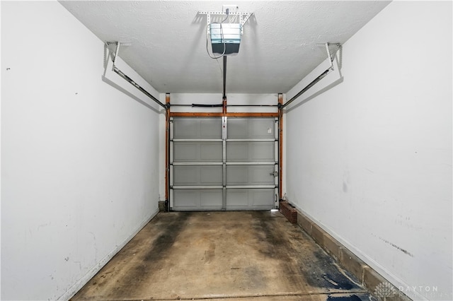 9670 Centerville Creek Ln, Washington Twp, OH 45458 - garage featuring a garage door opener and baseboards