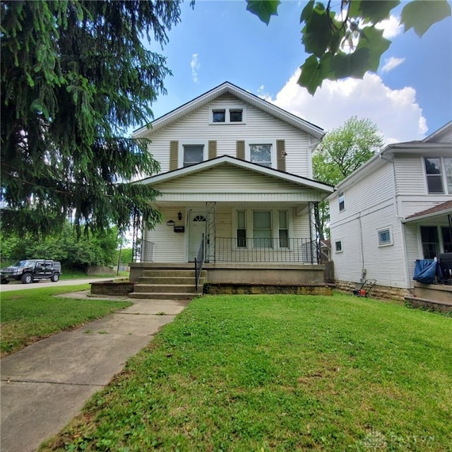 1271 Highland Ave, Dayton, OH 45410 - american foursquare style home featuring covered porch and a front yard