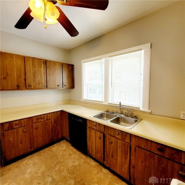 1271 Highland Ave, Dayton, OH 45410 - kitchen featuring black dishwasher, brown cabinets, ceiling fan, and light countertops