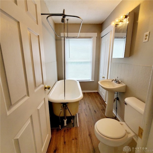 1271 Highland Ave, Dayton, OH 45410 - bathroom with a soaking tub, wood finished floors, a shower, and tile walls