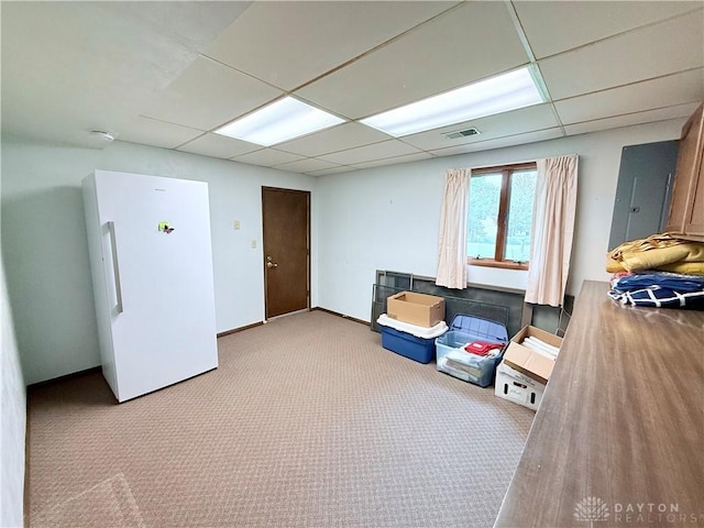 5778 Cedarwood Dr, Lewisburg, OH 45338 - below grade area with freestanding refrigerator, carpet, and a drop ceiling