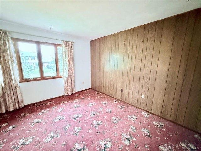 5778 Cedarwood Dr, Lewisburg, OH 45338 - empty room with carpet, wood walls, and baseboards