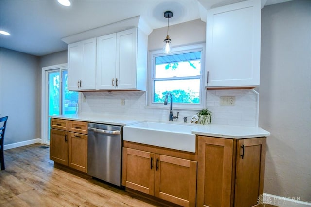 4189 W Franklin St, Bellbrook, OH 45305 - kitchen with stainless steel dishwasher, backsplash, light countertops, light wood-style flooring, and recessed lighting