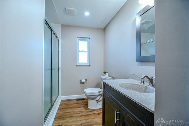 4189 W Franklin St, Bellbrook, OH 45305 - bathroom featuring a shower stall, vanity, and wood finished floors