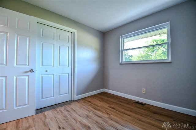 4189 W Franklin St, Bellbrook, OH 45305 - unfurnished bedroom featuring a closet and wood finished floors