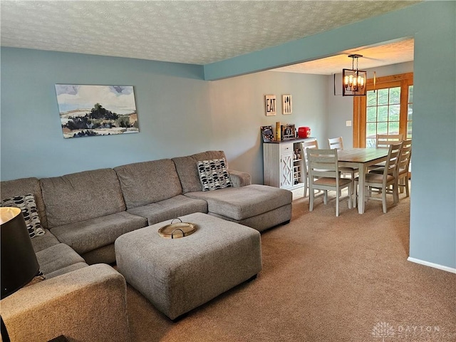 2547 Ryan Ct, Beavercreek, OH 45434 - carpeted living room with a chandelier and a textured ceiling