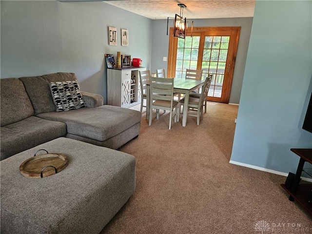 2547 Ryan Ct, Beavercreek, OH 45434 - living room with light carpet, a chandelier, and baseboards