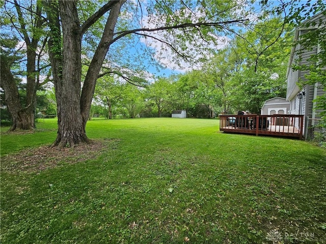 2547 Ryan Ct, Beavercreek, OH 45434 - view of grassy yard featuring a wooden deck