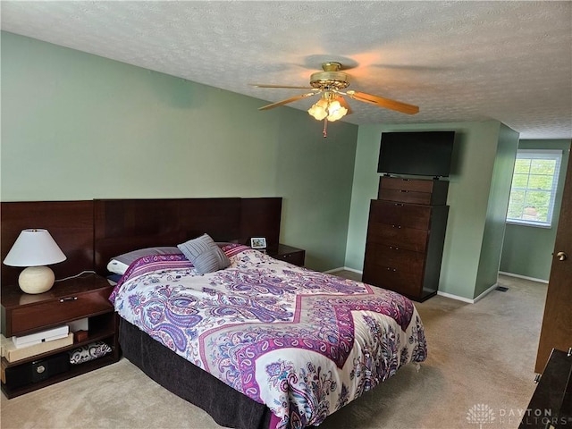 2547 Ryan Ct, Beavercreek, OH 45434 - carpeted bedroom with a textured ceiling, baseboards, and a ceiling fan