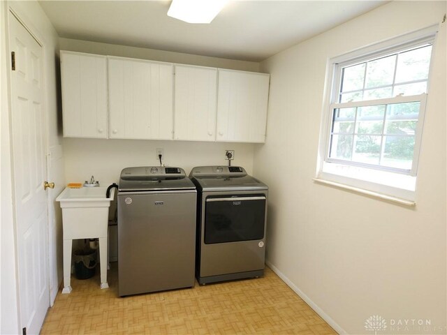 2547 Ryan Ct, Beavercreek, OH 45434 - laundry area with cabinet space, independent washer and dryer, baseboards, and light flooring