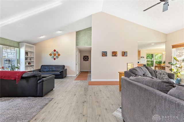 9300 Somerset Ct, Clearcreek Twp, OH 45458 - living area with ceiling fan, light wood-type flooring, high vaulted ceiling, and baseboards