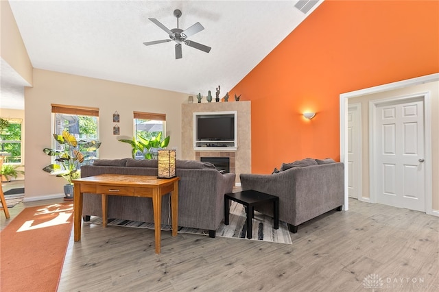 9300 Somerset Ct, Clearcreek Twp, OH 45458 - living room featuring a ceiling fan, wood finished floors, high vaulted ceiling, and baseboards