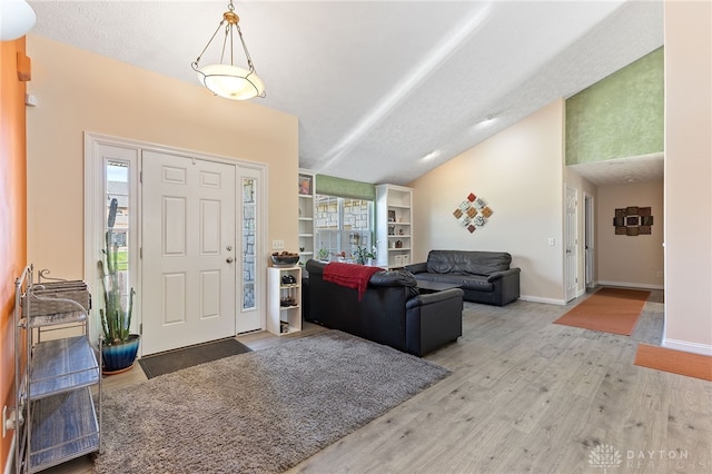 9300 Somerset Ct, Clearcreek Twp, OH 45458 - foyer featuring wood finished floors, lofted ceiling, and baseboards