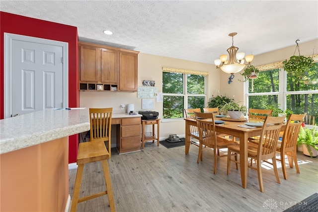9300 Somerset Ct, Clearcreek Twp, OH 45458 - dining area featuring a chandelier, light wood finished floors, a textured ceiling, recessed lighting, and baseboards