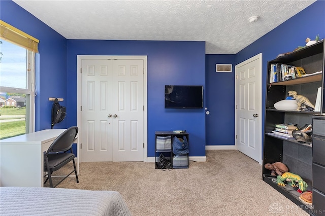9300 Somerset Ct, Clearcreek Twp, OH 45458 - carpeted bedroom with a closet, baseboards, a desk, and a textured ceiling