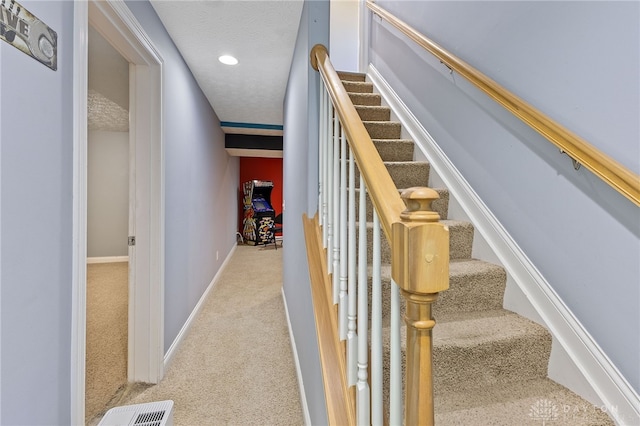 9300 Somerset Ct, Clearcreek Twp, OH 45458 - stairs featuring carpet floors, baseboards, recessed lighting, and a textured ceiling