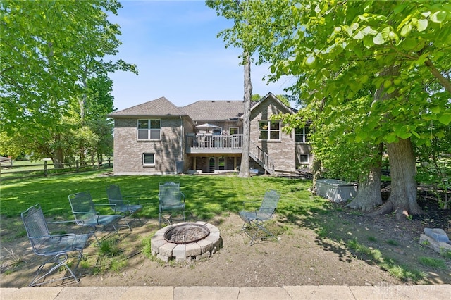 9300 Somerset Ct, Clearcreek Twp, OH 45458 - back of house with a fire pit, stairway, a wooden deck, and brick siding