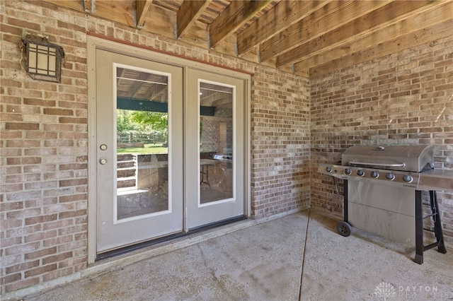9300 Somerset Ct, Clearcreek Twp, OH 45458 - view of exterior entry with brick siding and french doors