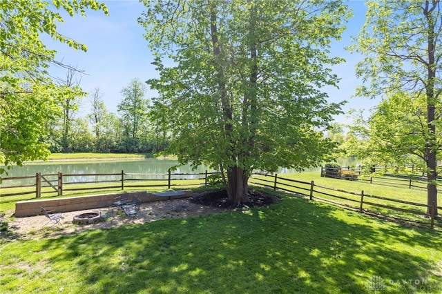 9300 Somerset Ct, Clearcreek Twp, OH 45458 - view of yard with an outdoor fire pit and a water view