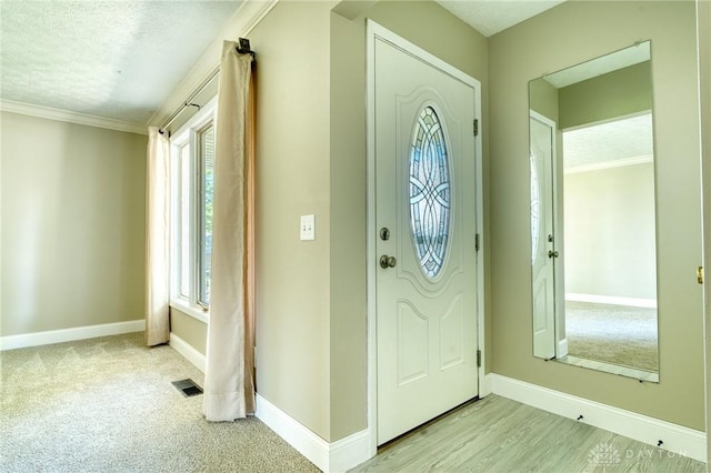 3339 Turner Dr, Springfield, OH 45504 - entrance foyer featuring baseboards, a textured ceiling, and ornamental molding