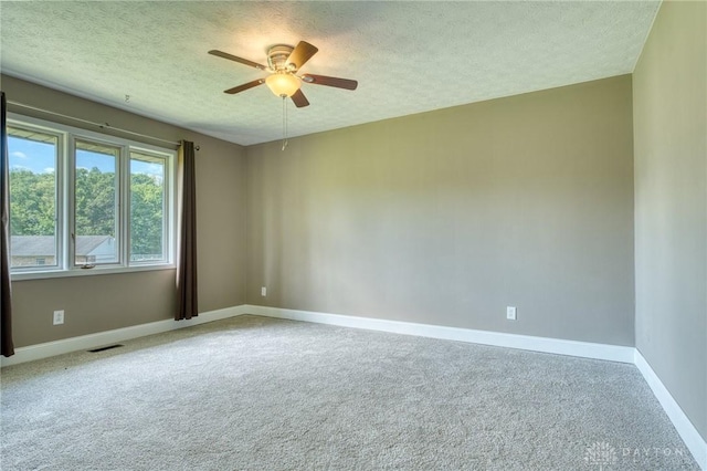 3339 Turner Dr, Springfield, OH 45504 - empty room featuring a textured ceiling, ceiling fan, baseboards, and carpet floors