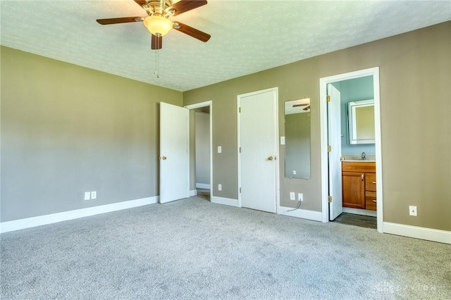 3339 Turner Dr, Springfield, OH 45504 - unfurnished bedroom featuring carpet flooring, a textured ceiling, baseboards, a sink, and ensuite bathroom