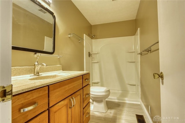 3339 Turner Dr, Springfield, OH 45504 - bathroom featuring toilet, a shower, vanity, and wood finished floors