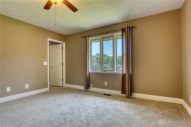 3339 Turner Dr, Springfield, OH 45504 - spare room featuring carpet floors, baseboards, a ceiling fan, and a textured ceiling