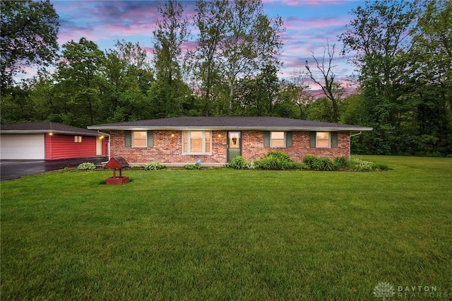 8590 Euphemia Castine Rd, Lewisburg, OH 45338 - ranch-style house featuring an outdoor structure, a lawn, and brick siding