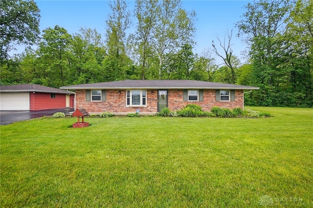 8590 Euphemia Castine Rd, Lewisburg, OH 45338 - ranch-style home featuring a front lawn, brick siding, and an outdoor structure