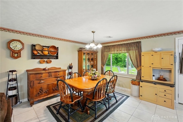 8590 Euphemia Castine Rd, Lewisburg, OH 45338 - dining room featuring light tile patterned floors, a chandelier, baseboards, and ornamental molding