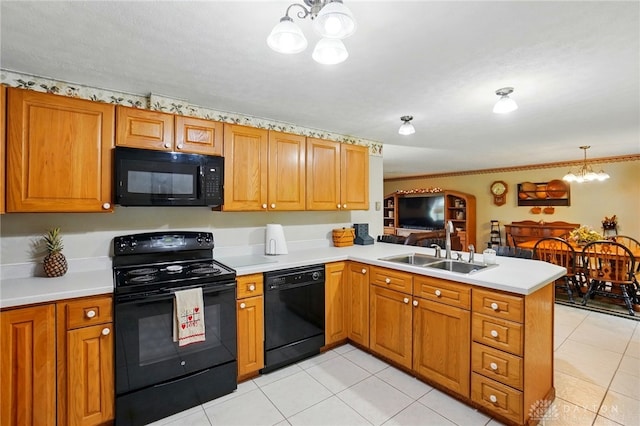 8590 Euphemia Castine Rd, Lewisburg, OH 45338 - kitchen featuring black appliances, a chandelier, a peninsula, a sink, and light countertops
