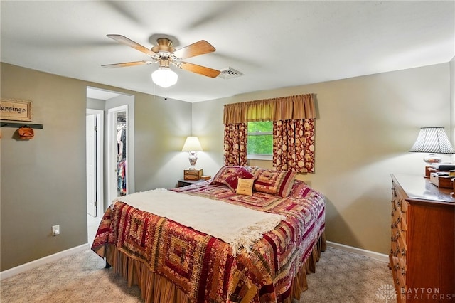 8590 Euphemia Castine Rd, Lewisburg, OH 45338 - bedroom featuring light carpet, baseboards, a ceiling fan, and a spacious closet