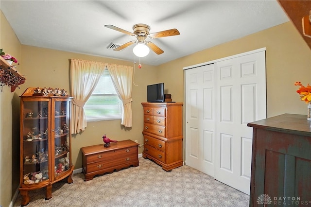 8590 Euphemia Castine Rd, Lewisburg, OH 45338 - bedroom featuring a closet, light carpet, a ceiling fan, and baseboards