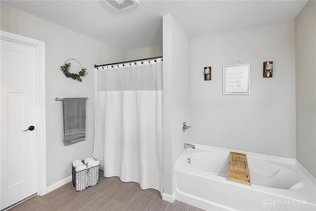 1691 Arden Bnd, Fairborn, OH 45324 - bathroom featuring a bath, baseboards, and curtained shower