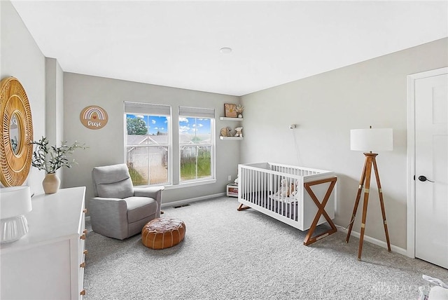 1691 Arden Bnd, Fairborn, OH 45324 - bedroom featuring carpet flooring, baseboards, and a crib