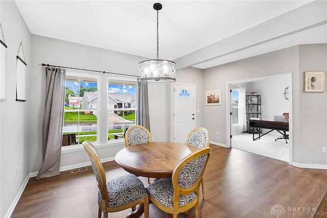 1691 Arden Bnd, Fairborn, OH 45324 - dining space with dark wood finished floors, a chandelier, and baseboards