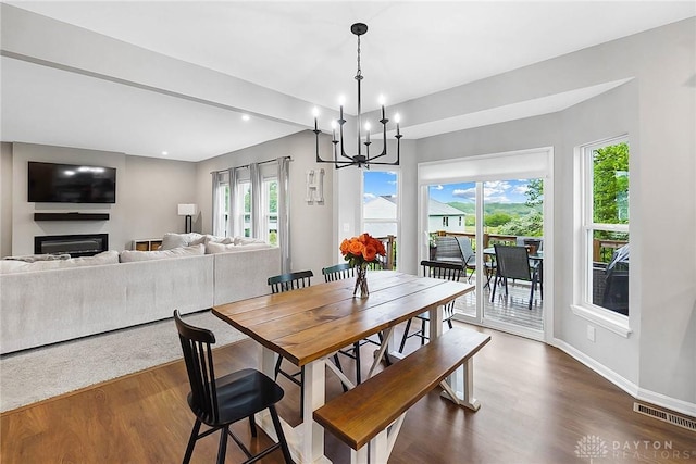 1691 Arden Bnd, Fairborn, OH 45324 - dining area with healthy amount of natural light, dark wood finished floors, a chandelier, baseboards, and recessed lighting