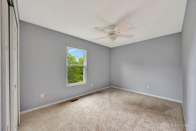 406 Forge Dr, Lebanon, OH 45036 - carpeted empty room with baseboards and a ceiling fan