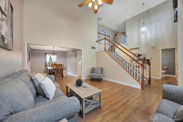406 Forge Dr, Lebanon, OH 45036 - living area with a high ceiling, stairs, ceiling fan, wood finished floors, and baseboards