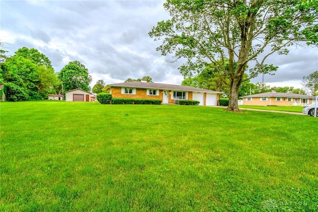 3653 Cloverdale Rd, Medway, OH 45341 - view of front of property with a front lawn, an attached garage, and a detached garage