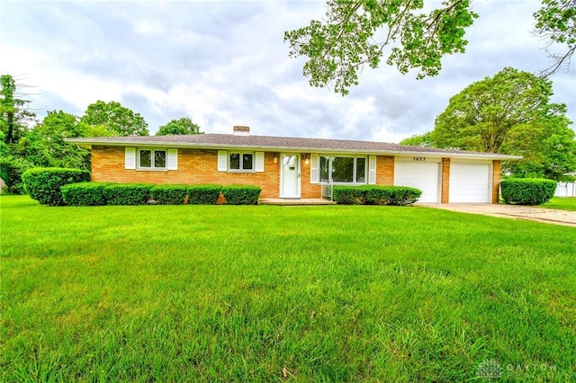 3653 Cloverdale Rd, Medway, OH 45341 - ranch-style house featuring a front lawn, a garage, and concrete driveway