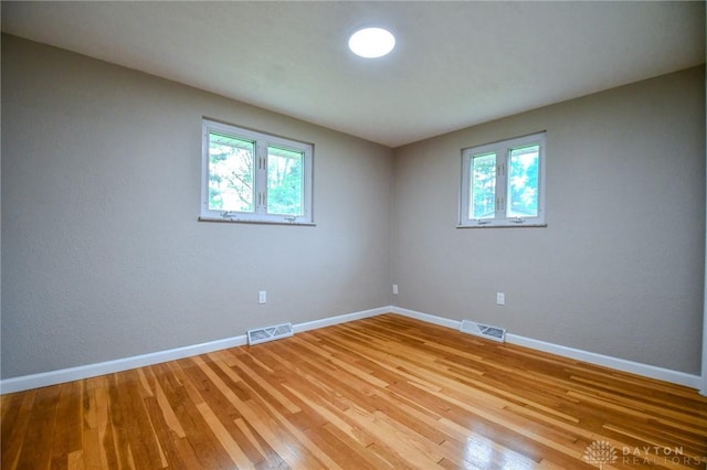 3653 Cloverdale Rd, Medway, OH 45341 - empty room with plenty of natural light, light wood-type flooring, and baseboards