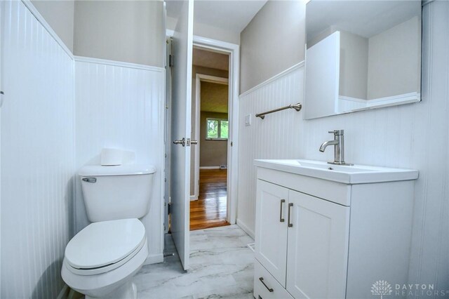 3653 Cloverdale Rd, Medway, OH 45341 - half bathroom with marble finish flooring, vanity, and toilet