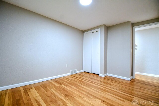 3653 Cloverdale Rd, Medway, OH 45341 - unfurnished bedroom featuring light wood-type flooring, baseboards, and a closet