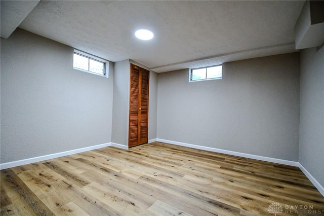 3653 Cloverdale Rd, Medway, OH 45341 - below grade area with wood finished floors, baseboards, and a textured wall
