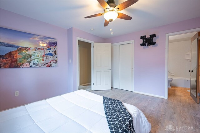 2444 Tennyson Dr, Bellbrook, OH 45305 - bedroom featuring wood finished floors, baseboards, a closet, and a ceiling fan